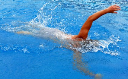 A man swimming in a pool