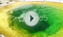 A Green Smoking Pool Of Water In Yellowstone National Park
